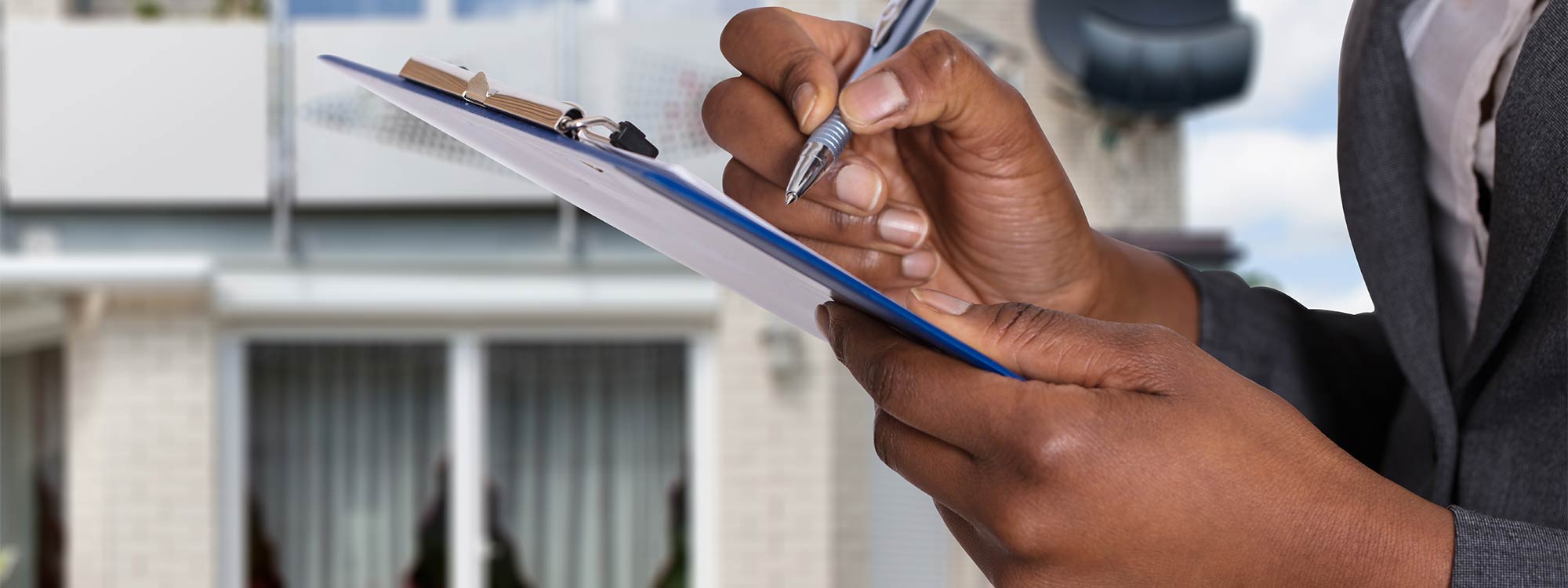 Man Inspecting Home